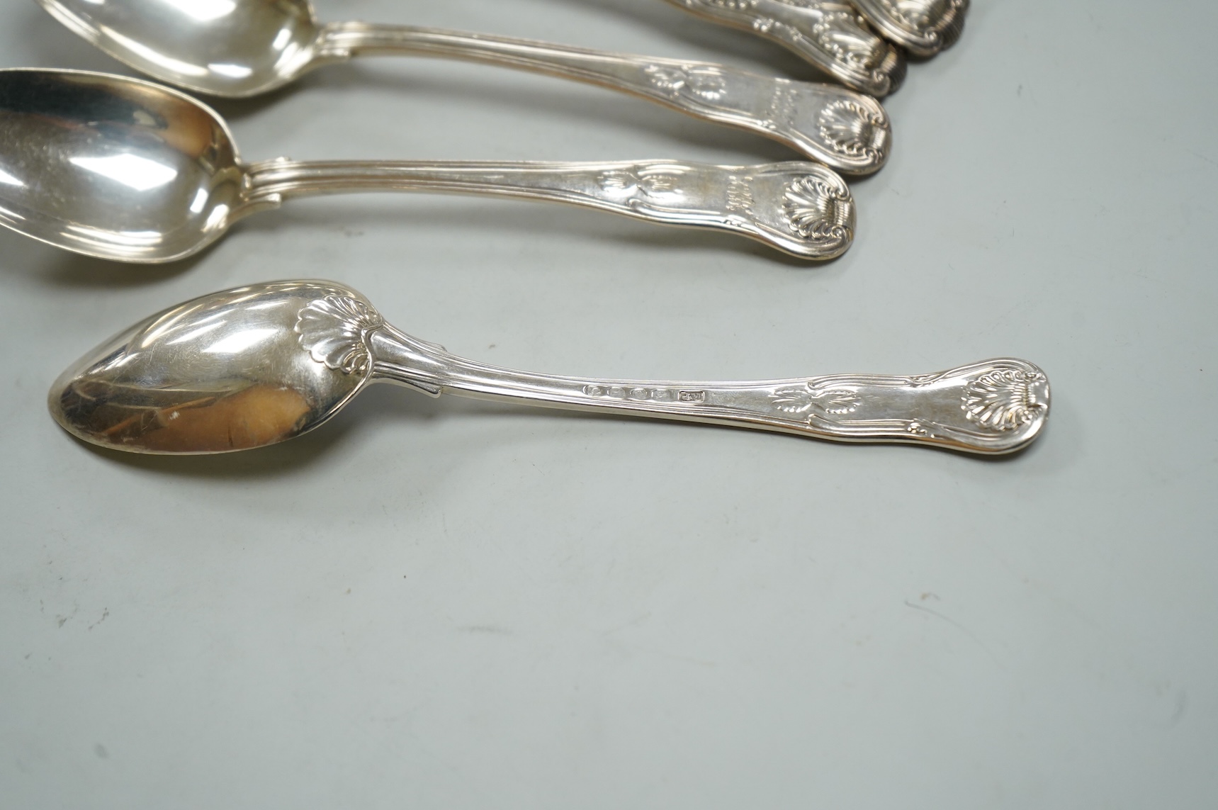 A matched set of six Victorian silver Kings pattern dessert spoons, including three by George Adams, London, 1865, 11.9oz.